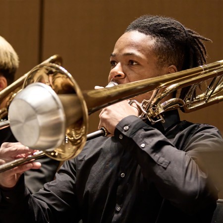 PYP musicians playing the trombone